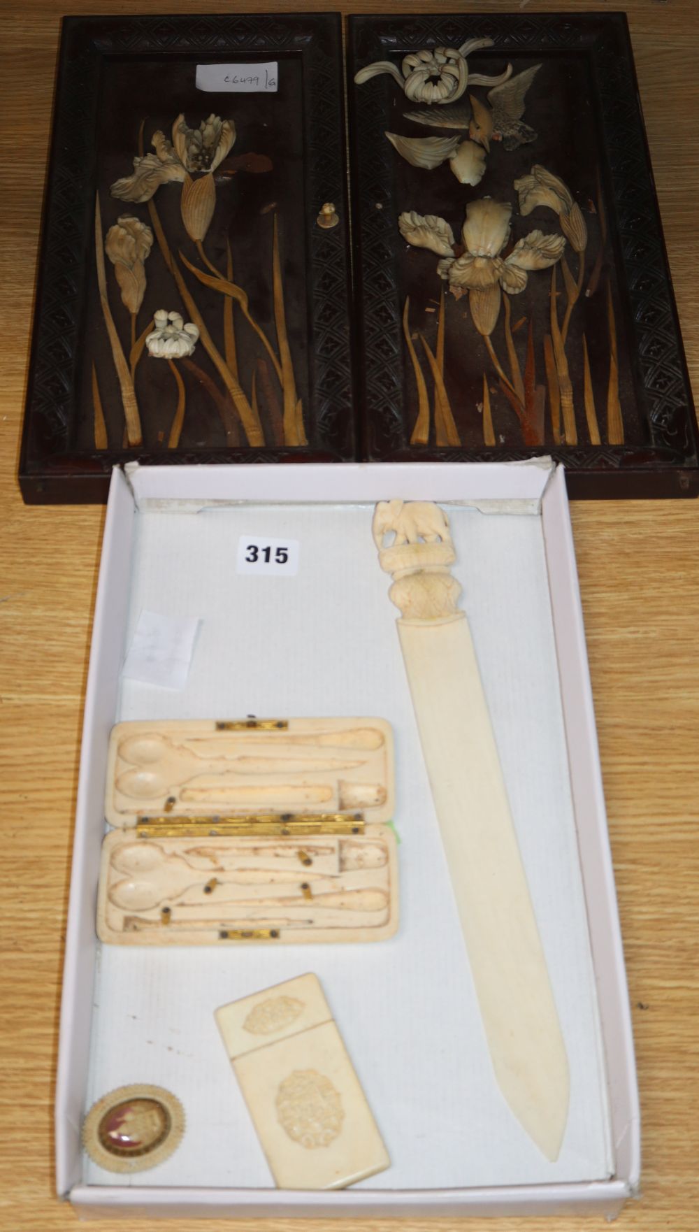 A Canton ivory card case, a page turner, a necessaire case and a pair of Japanese hardwood plaques